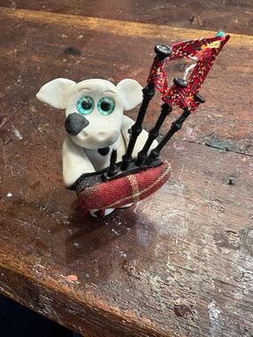 Handmade Clay Cow Figurine with Mini Bagpipes